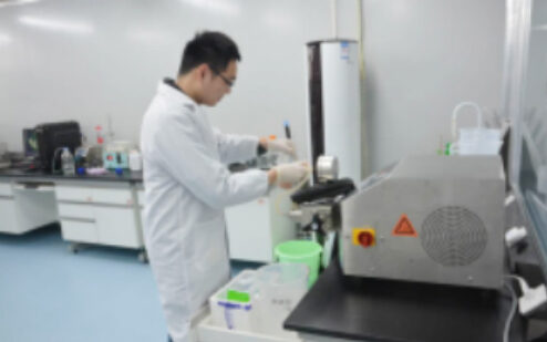 Technician operating equipment in the laboratory
